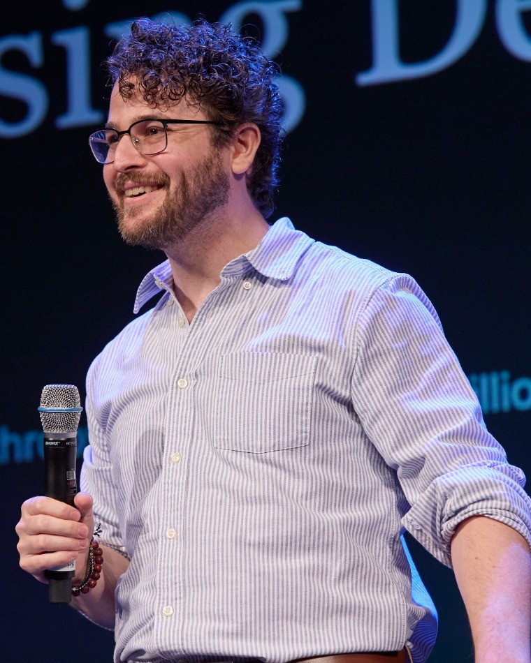 Zack Braunstein speaking on stage
